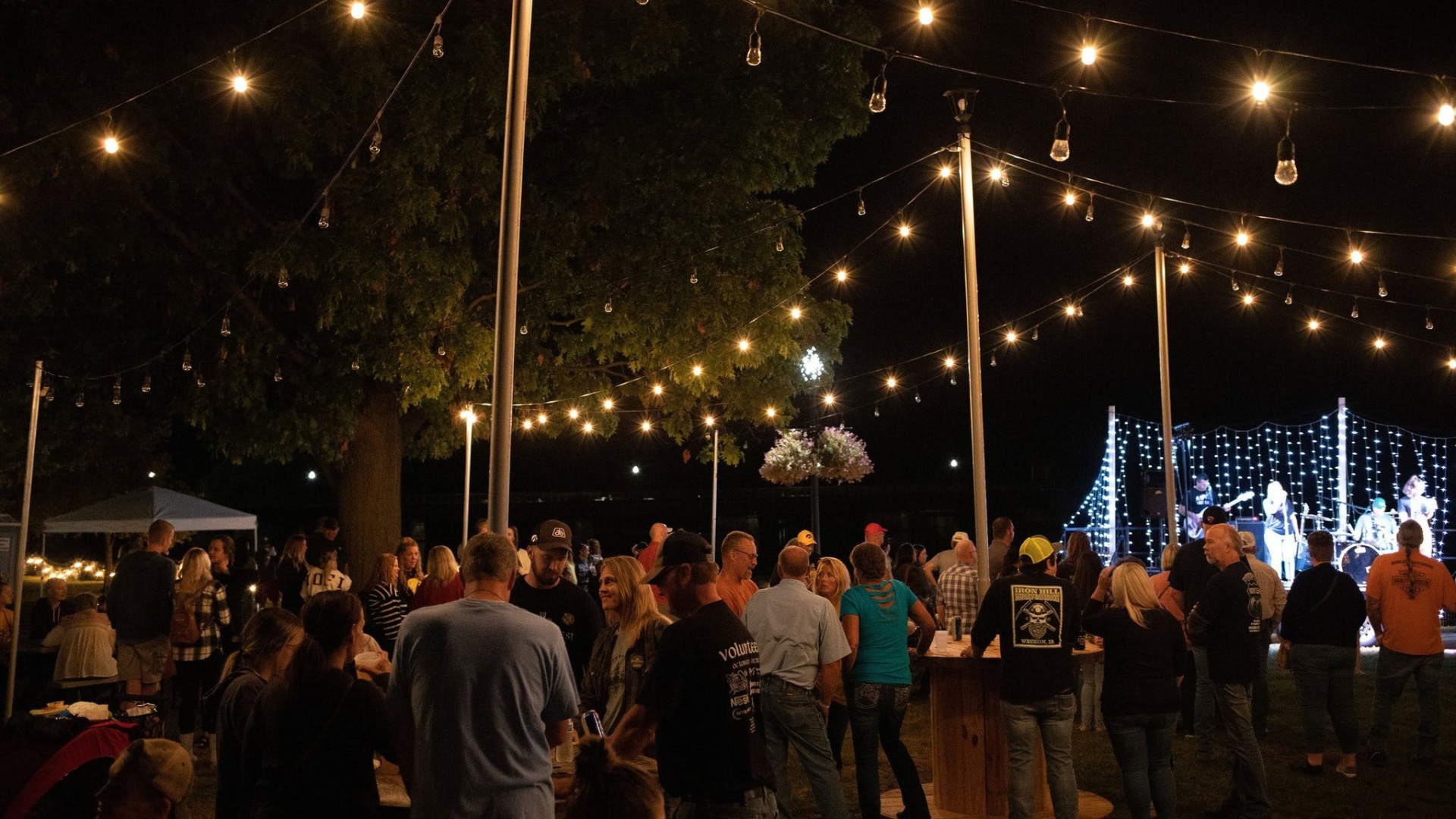 Festive lights hang above the Oktoberfest celebration.
