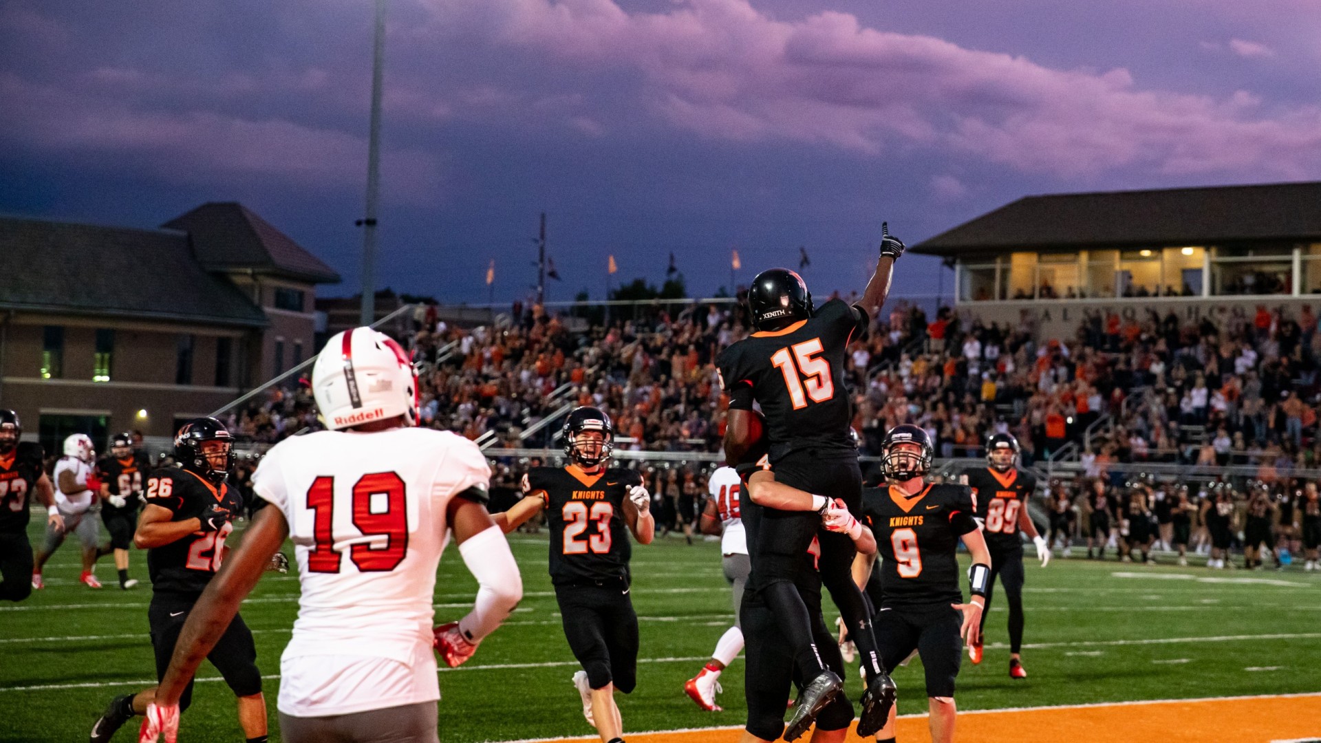 Image of Wartburg College football game with players in the field playing